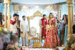 A richly dressed Indian bride and groom at their wedding ceremony.